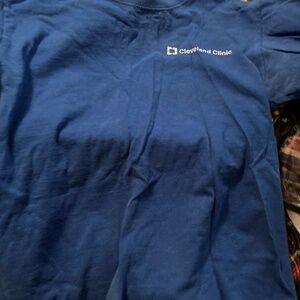 Blue Cleveland clinic t shirt.